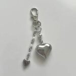 ute pink acrylic heart-shaped keychain with gold clasp for Evarima gift boxes.