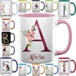 Ceramic coffee mug with various font styles for custom name printing.